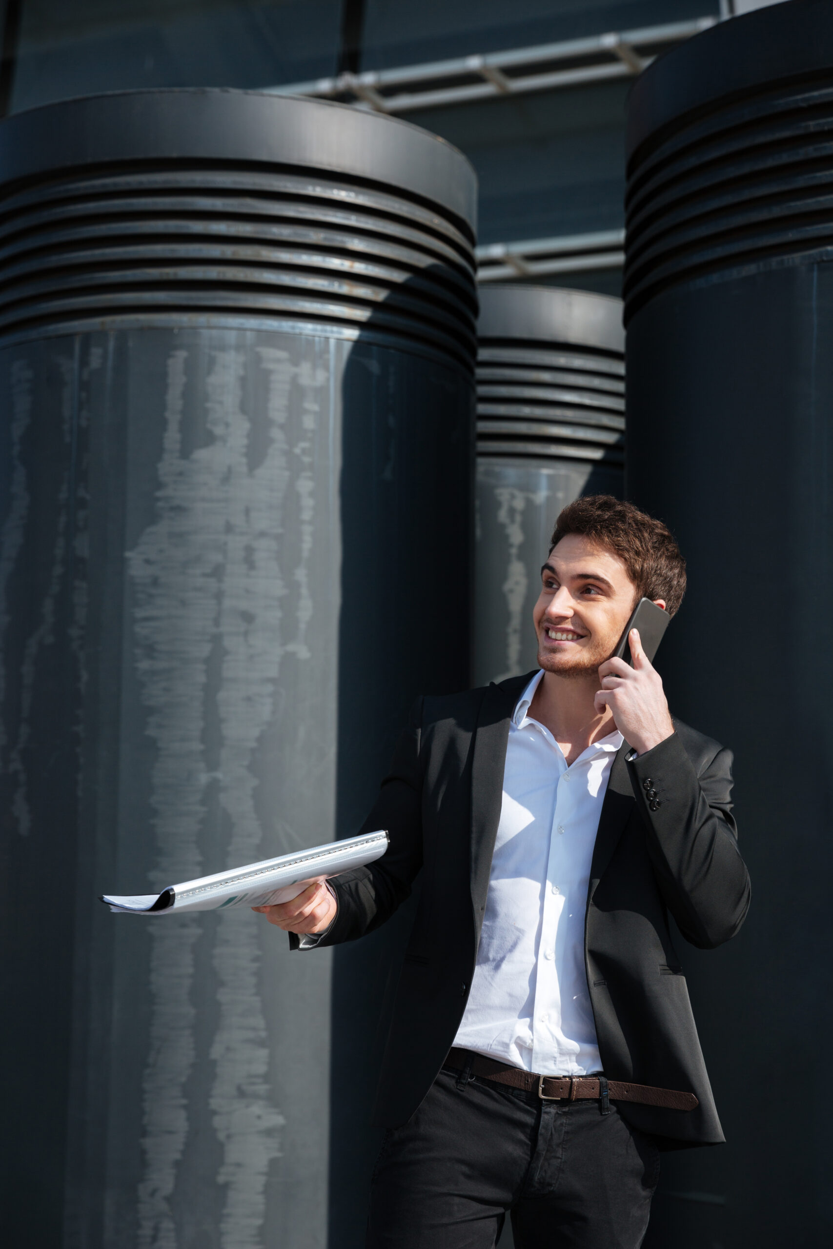 cheerful businessman talking on phone